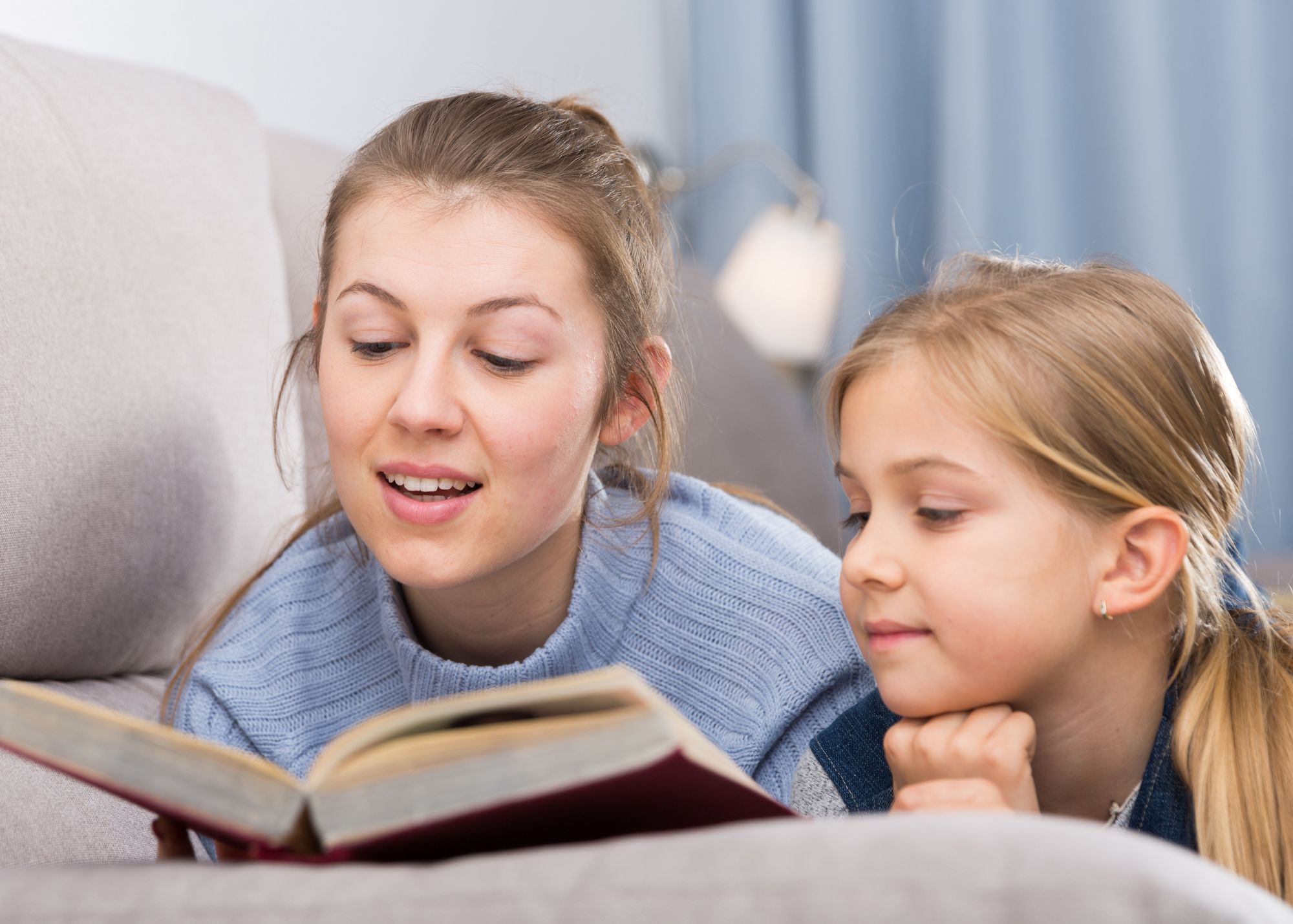 Read the Bible aloud while your kids snuggle up and listen